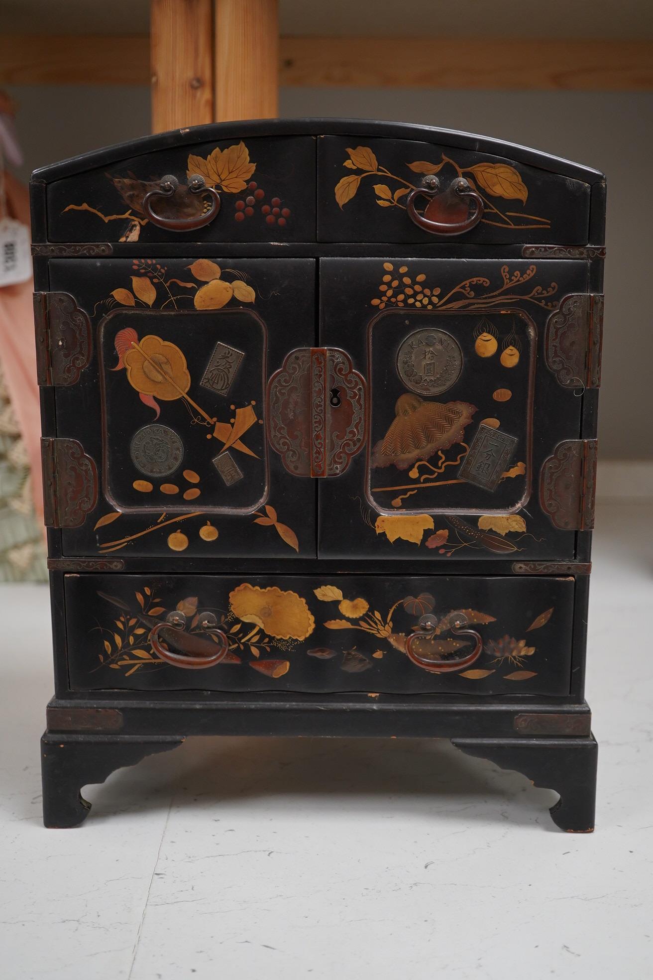 A late 19th early 20th century Japanese lacquer cabinet, 31cm high. Condition - exterior chipped and cracked near the top edge